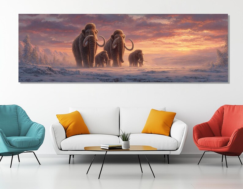 May include: A panoramic canvas print depicts a family of woolly mammoths walking across a snowy landscape. The artwork features a warm sunset with shades of orange, pink, and purple, creating a serene and prehistoric scene.