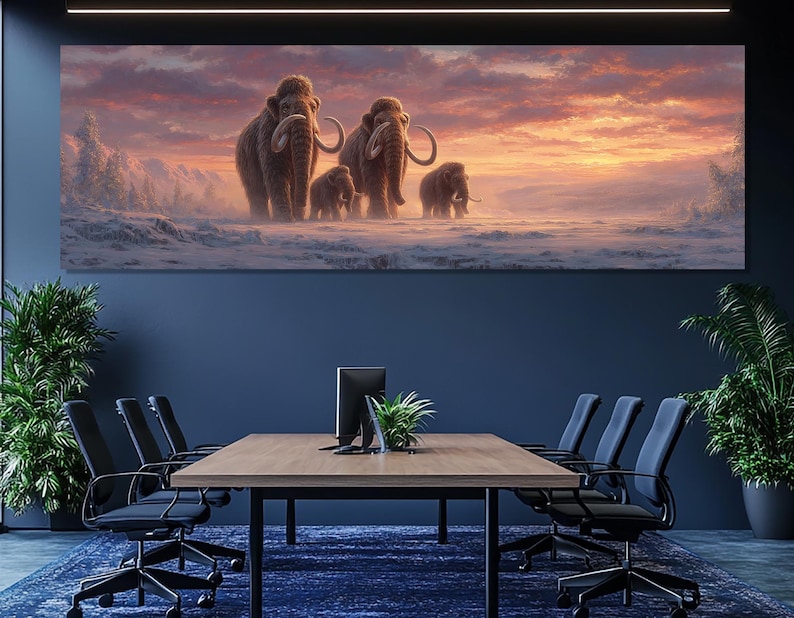 May include: A large canvas print depicting a family of woolly mammoths in a snowy landscape under a sunset sky. The mammoths are brown with large tusks. The sky is a mix of orange, pink, and purple hues.