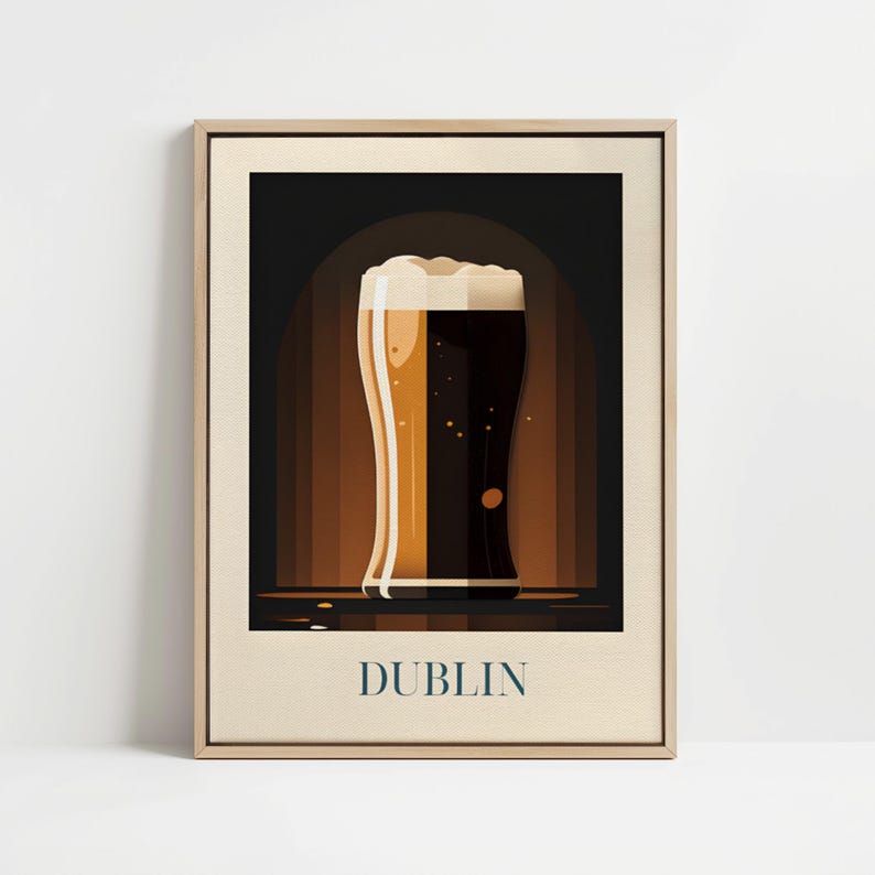 May include: A framed poster with a graphic illustration of a glass of beer with a dark brown liquid and a white head. The text "DUBLIN" is printed in blue at the bottom of the poster.