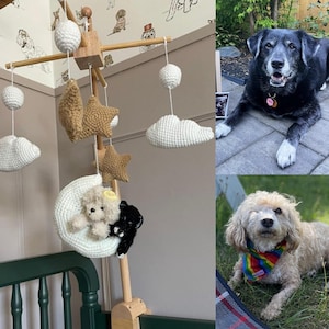 May include: A wooden baby mobile with crocheted clouds, stars, and a crescent moon with two stuffed animals. The mobile is hanging above a white cot with green wooden rails.