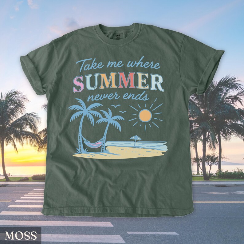 May include: Moss green t-shirt with a beach scene graphic. The graphic includes palm trees, a hammock, the sun, and the text "Take me where SUMMER never ends". The shirt is made of a soft material.