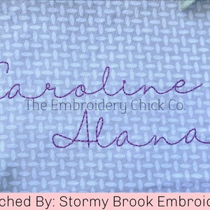 May include: Purple embroidered names "Caroline" and "Alana" on a light blue fabric with a white pattern. The text "The Embroidery Chick Co." is below the name "Caroline". The text "Stitched By: Stormy Brook Embroidery" is at the bottom of the image.