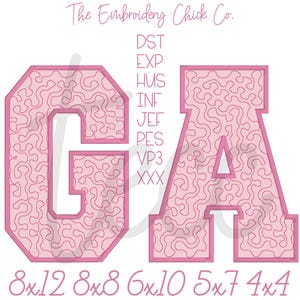 May include: Pink embroidered letters "GA" with a swirling pattern fill, outlined in a darker pink. The text "The Embroidery Chick Co." is at the top. Below the letters are various embroidery file formats and sizes.