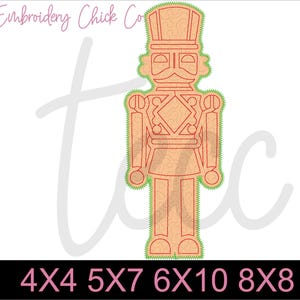 May include: A digital embroidery design of a nutcracker soldier in red and green. The design is available in multiple sizes: 4x4, 5x7, 6x10, and 8x8 inches.