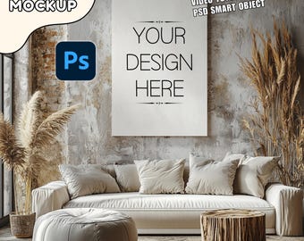 May include: A canvas mockup with the text "YOUR DESIGN HERE" displayed on a white canvas. The scene includes a white sofa, pillows, and a wooden side table, creating a cozy, neutral-toned interior design setting.