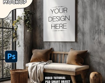May include: A canvas mockup with the text "YOUR DESIGN HERE" hanging on a gray wall. Below, a wooden bench with two brown pillows and a white blanket. A wicker basket and a wooden stool are on the floor. The text "CANVAS MOCKUP" is in the upper left corner.