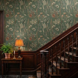 May include: Wallpaper featuring a botanical pattern with white, cream, and muted orange wildflowers and tall grasses on a deep sage green background. The design covers a wall surface, showcasing a repeating floral motif with thin stems and leaves.