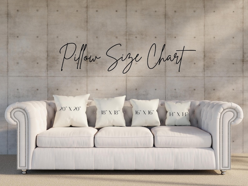 May include: A white tufted sofa with four pillows of varying sizes: 20" x 20", 18" x 18", 16" x 16", and 14" x 14". The text "Pillow Size Chart" is above the pillows. The background is a concrete wall.