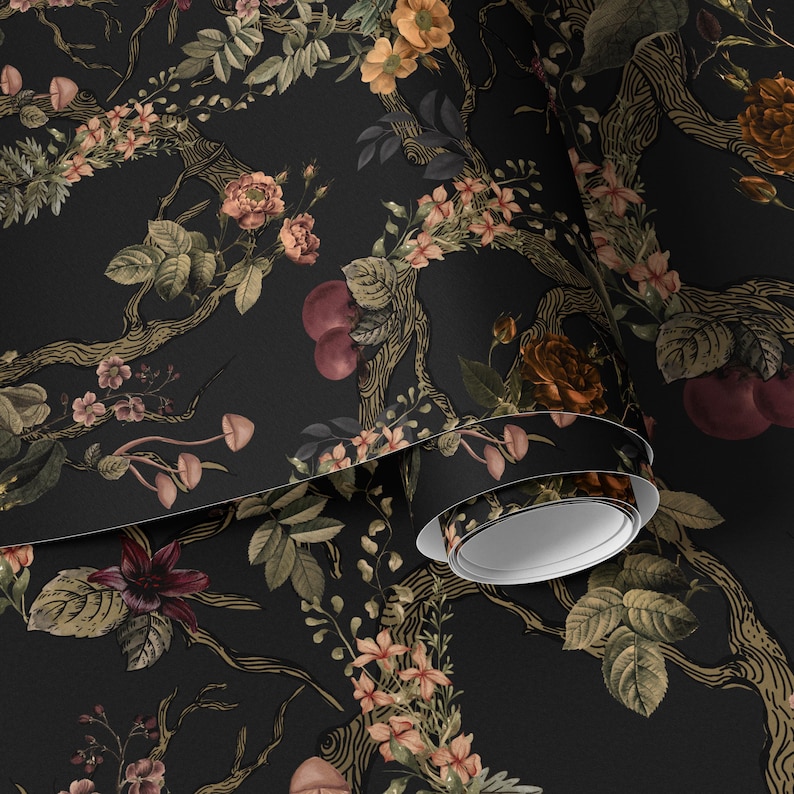 May include: Dark wallpaper featuring a botanical design with a black background. The pattern includes stylized trees, flowers in shades of peach, orange, and burgundy, and various green leaves. A roll of the wallpaper is visible in the image.