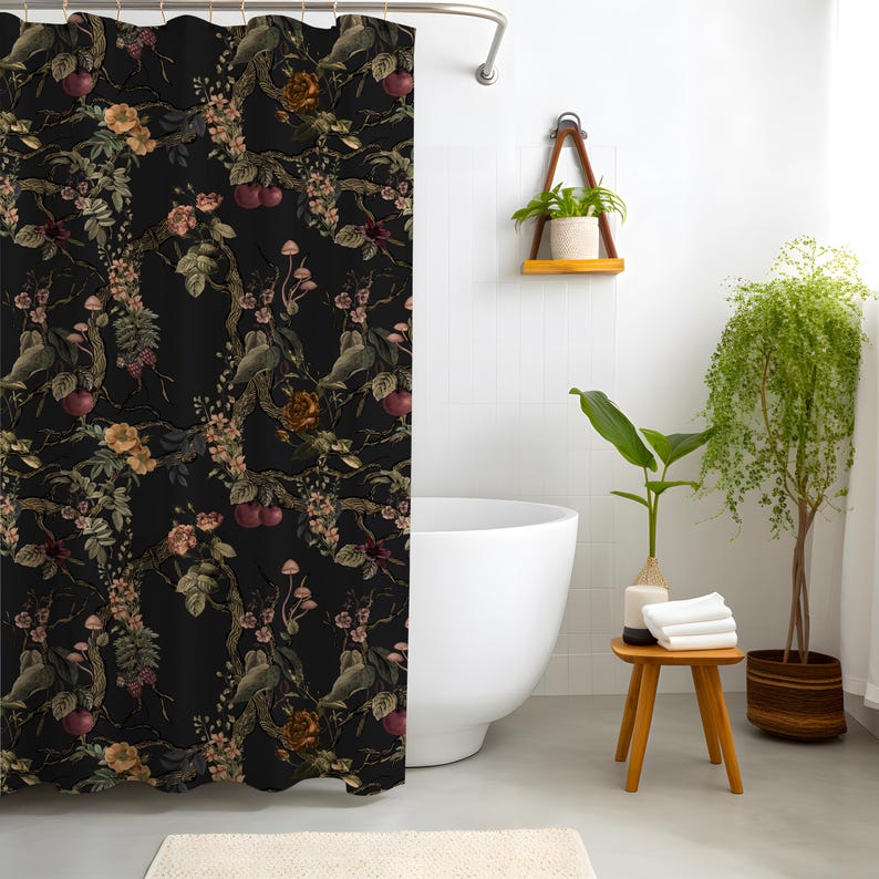 May include: A black shower curtain featuring a repeating botanical pattern of dark tree branches, small red cherries, light pink blossoms, brown roses, and tiny mushrooms. The fabric hangs from a silver rod with metal rings at the top edge.