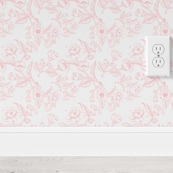 May include: Wallpaper featuring a repeating pattern of light pink line-drawn roses and leaves on a white background. A white electrical outlet is mounted on the wall surface, positioned above a plain white baseboard trim at the bottom.