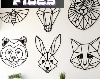 May include: A collection of black geometric animal head wall art, including a fox, bear, and rabbit, displayed on a white wall. The image also features the text "80+ STL FILES" in white with a purple outline.