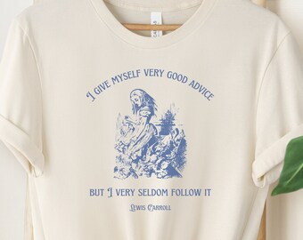 May include: A cream colored t-shirt with a blue illustration of a woman and the text "I give myself very good advice but I very seldom follow it - Lewis Carroll".