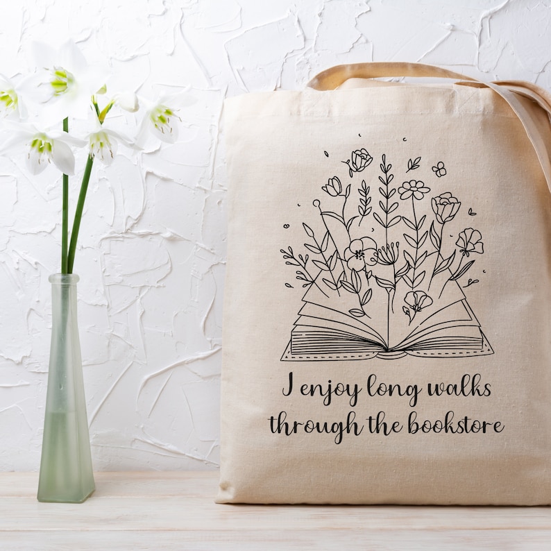 Bookish Tote, Booktrovert Tote Bag, Book Lovers Book Bag, Gift for English Teacher, Librarian Gift with funny quote that says I enjoy long walks through the bookstore. Cottagecore wildflowers and book. Cute bag for booksellers and book nerds.