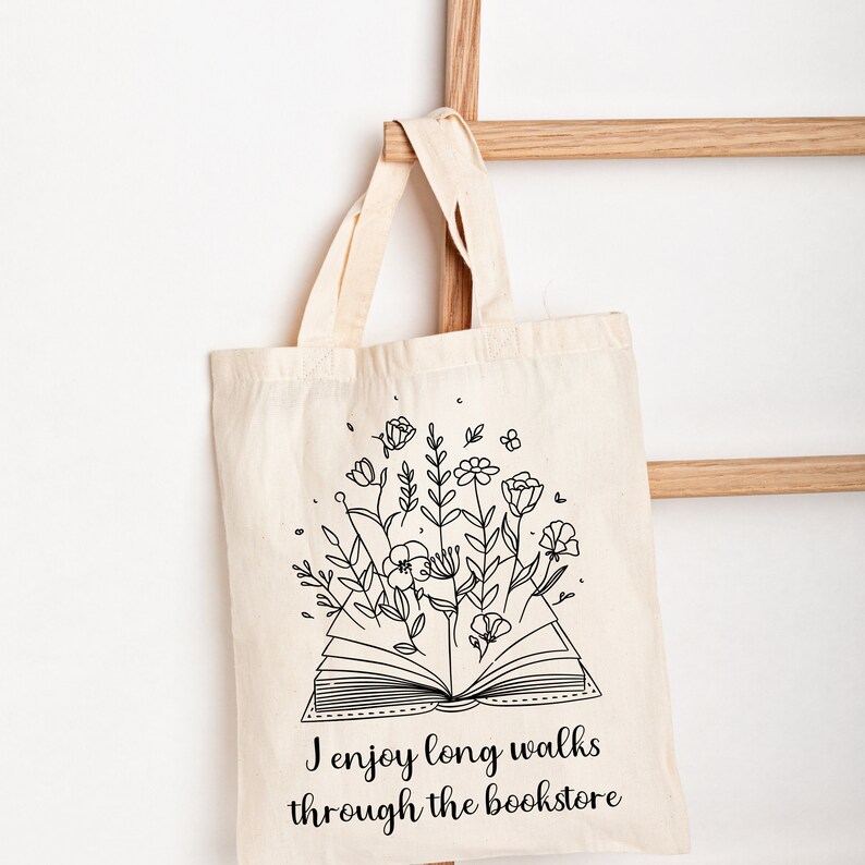 Bookish Tote, Booktrovert Tote Bag, Book Lovers Book Bag, Gift for English Teacher, Librarian Gift with funny quote that says I enjoy long walks through the bookstore. Cottagecore wildflowers and book. Cute bag for booksellers and book nerds.