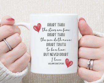 May include: White ceramic mug with a red heart and a quote from William Shakespeare that reads: "Doubt thou the stars are fire: Doubt thou the sun doth move; Doubt truth to be a liar: But never doubt I love."