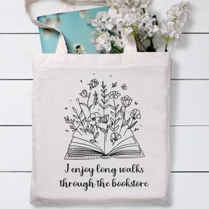 Bookish Tote, Booktrovert Tote Bag, Book Lovers Book Bag, Gift for English Teacher, Librarian Gift with funny quote that says I enjoy long walks through the bookstore. Cottagecore wildflowers and book. Cute bag for booksellers and book nerds.
