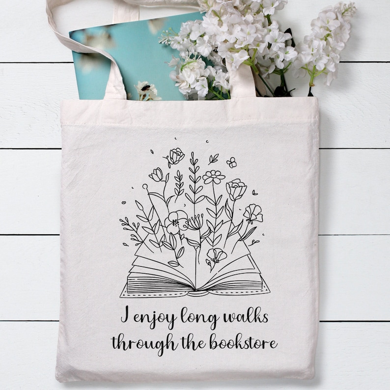 Bookish Tote, Booktrovert Tote Bag, Book Lovers Book Bag, Gift for English Teacher, Librarian Gift with funny quote that says I enjoy long walks through the bookstore. Cottagecore wildflowers and book. Cute bag for booksellers and book nerds.