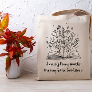 Bookish Tote, Booktrovert Tote Bag, Book Lovers Book Bag, Gift for English Teacher, Librarian Gift with funny quote that says I enjoy long walks through the bookstore. Cottagecore wildflowers and book. Cute bag for booksellers and book nerds.