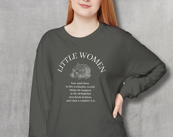 May include: A dark gray long-sleeved shirt with the text "LITTLE WOMEN" in a white arc above a black and white illustration of a house. The text below the illustration reads "Now and then, in this workaday world, things do happen in the delightful storybook fashion, and what a comfort it is."