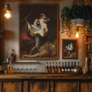 May include: Two framed art prints depicting a classical scene with a figure holding a tiger over an elephant. The larger print is centered, with a smaller version to the right. The scene is set against a dark background.