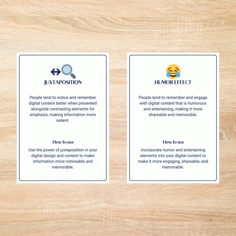 May include: Two cards with blue borders and white text on a wood background. The card on the left has a magnifying glass and arrows pointing left and right. The text on the card is "Juxtaposition". The card on the right has a yellow emoji with a laughing face and tears of joy. The text on the card is "Humor Effect".