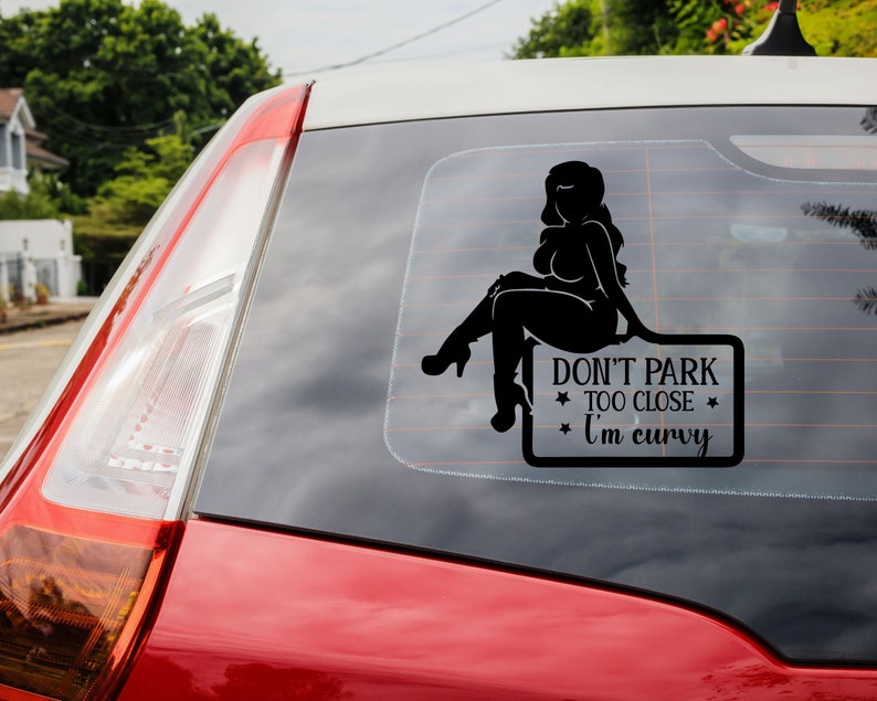May include: Black and white silhouette of a woman sitting on a sign that reads "Don't park too close I'm curvy".