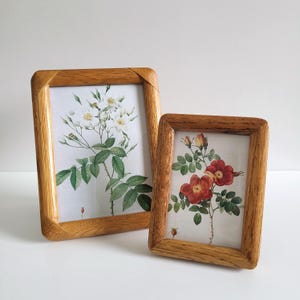 May include: A set of three ceramic mugs with a speckled, matte finish in cream, light grey, and dark grey. Each mug has a simple, minimalist design, suitable for coffee or tea.