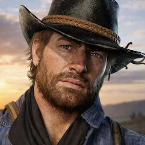 May include: A portrait of a man wearing a black cowboy hat with a brown braided band. He has a beard and is wearing a blue denim shirt and a black scarf. The background shows a sunset.