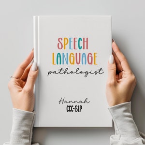 May include: A white book with the text "SPEECH LANGUAGE pathologist" in colorful letters. The text "Hannah CCC-SLP" is written in black below the title.