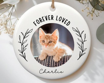 May include: White ceramic ornament with a photo of a cat and the text "Forever Loved" and "Charlie".