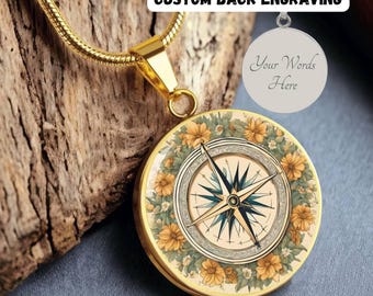 May include: Gold necklace with a compass pendant surrounded by yellow flowers. The back of the pendant can be engraved with a custom message. "Your Words Here" is shown on the back of the pendant.