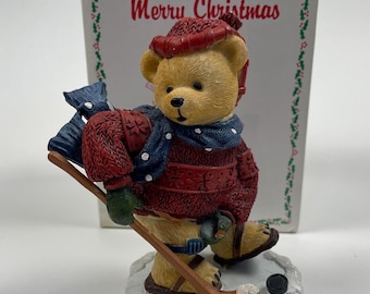 Figura de osito de hockey de Leon - 100.º aniversario 2009 Feliz Navidad