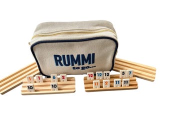 Mini Rummi Kub travel set . Canvas bag, 160 Rummi kub game tiles and 4 wooden racks all in our sturdy and chic Rummi to go bag.