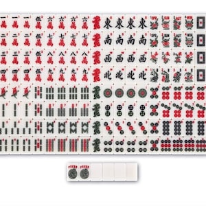 May include: A full set of white Mahjong tiles, marked in red and black with Chinese characters, numbers, and symbols. Several tiles are separate, displaying the word "JOKER". This traditional game set is ready to play.