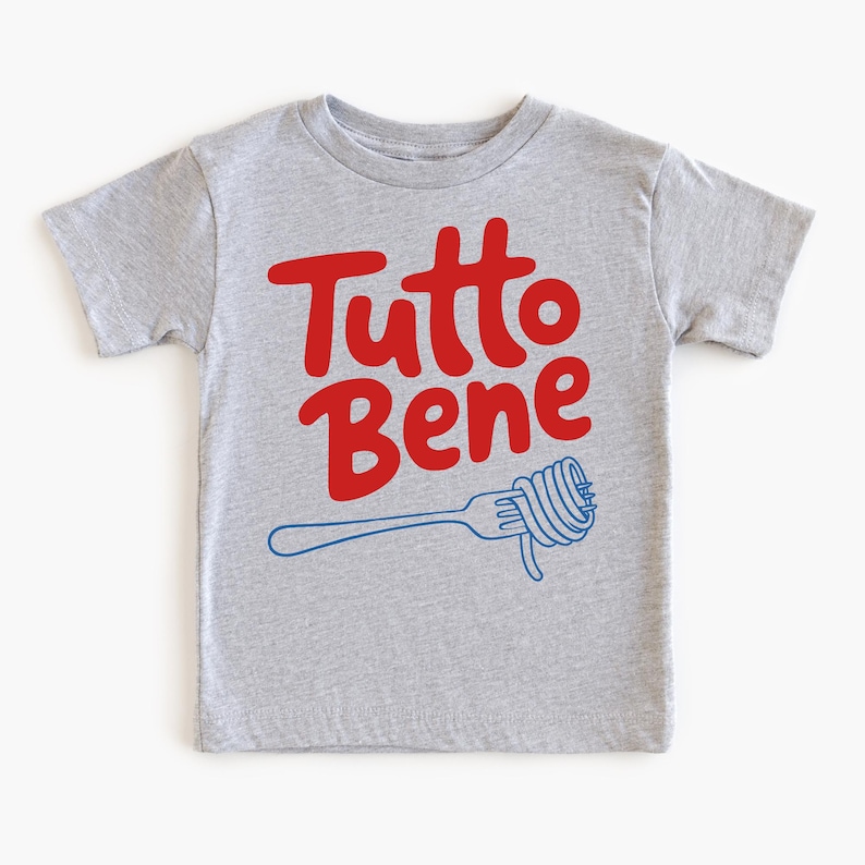 A gray t-shirt with the text "Tutto Bene" printed on it, along with a graphic of a fork with spaghetti.