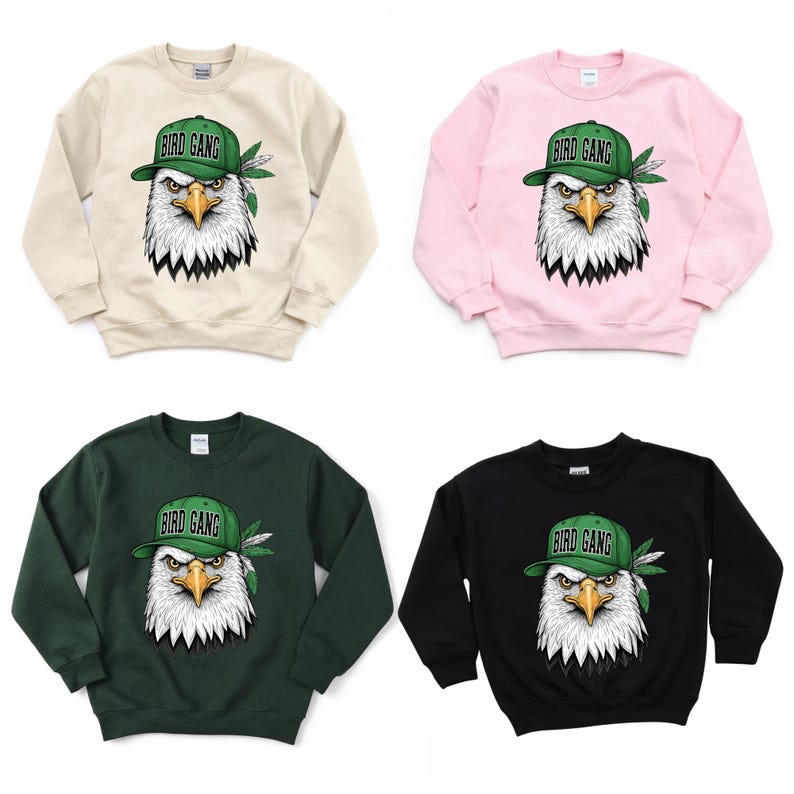 four different sweatshirts with a graphic of an eagle wearing a hat and the text "BIRD GANG" printed on them.