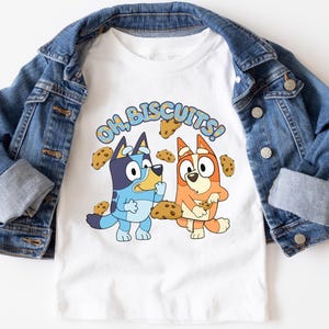 Oh Biscuits Blue Dog T-Shirt – Funny Cartoon Dog Tee, Cute Family Matching Shirt, Soft & Comfortable Unisex Tee