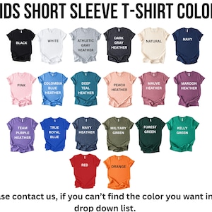 a collection of short sleeve t-shirt colors, including black, white, gray, natural, navy, pink, blue, deep blue, peach, maroon, navy, pink, true blue, navy, forest green, green, red, orange, and yellow.