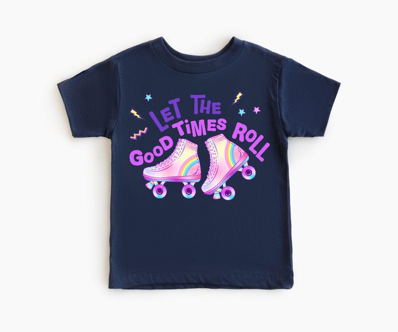 A navy blue t-shirt with a graphic design featuring two roller skates and the text "Let the good times roll" in a colorful, playful style.