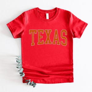 a red shirt with the word texas on it