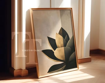 May include: A framed art print with a gold frame, showcasing a stylized botanical design. The artwork presents a large, abstract flower in black, beige, and gold tones. The print is leaning against a white wall and a wooden floor.