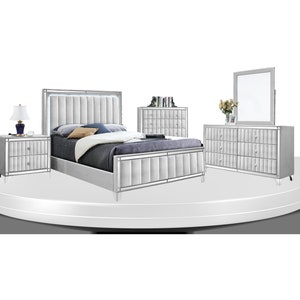 May include: A silver bedroom set featuring a tufted headboard, two bedside tables, a chest of drawers, and a mirror. The set has a contemporary design with a mirrored finish.