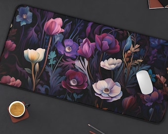 May include: A dark purple and black floral mouse pad with a white computer mouse on top. The mouse pad features a variety of flowers in shades of purple, pink, and white.