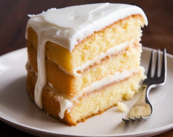 May include: A slice of layered yellow cake with white frosting and filling, served on a white plate. The frosting drips down the side of the cake. A silver fork rests on the plate next to the cake.
