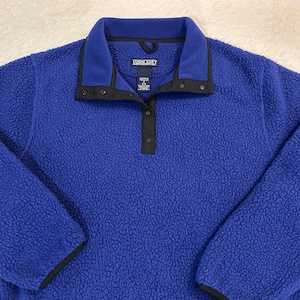 May include: A rustic wooden sign with the text "Welcome to our home" in white lettering. The sign features a distressed finish and a simple, inviting design, perfect for front door decor.