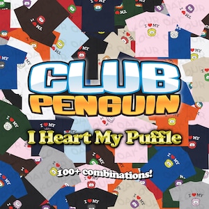 May include: A collage of various colored t-shirts featuring the Club Penguin logo and the text I Heart My Puffle. The graphic includes numerous small circular Puffle characters in different colors, each paired with a red heart icon.