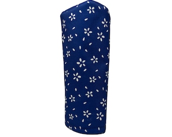 May include: Blue golf club head cover with a white floral pattern.