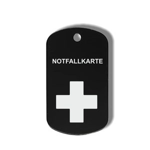 May include: Black metal dog tag with a white Swiss cross and the text "NOTFALLKARTE" in white.