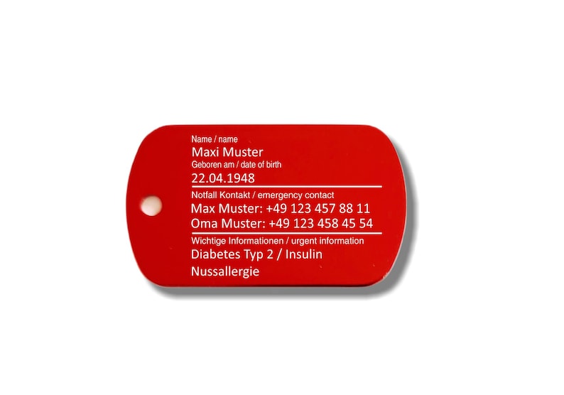 May include: Red rectangular tag with white text. The tag includes the name Maxi Muster, date of birth 22.04.1948, emergency contact information, and important information about diabetes type 2, insulin, and nut allergy.